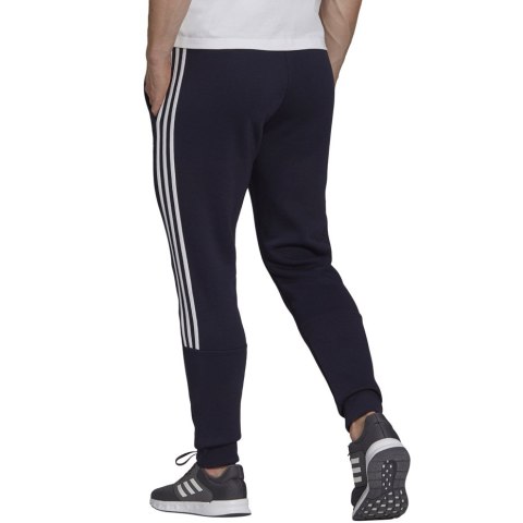 Spodnie męskie adidas Essentials Tapered Cuff 3 Stripes granatowe GK8977 Adidas