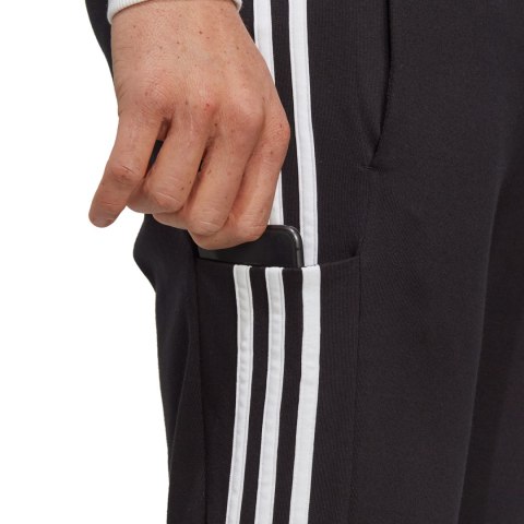 Spodnie męskie adidas Essentials Single Jersey Tapered Open Hem 3-Stripes czarne IC0044 Adidas