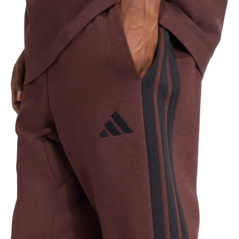 Spodnie męskie adidas Essentials 3-Stripes Fleece brązowe JX0749 Adidas
